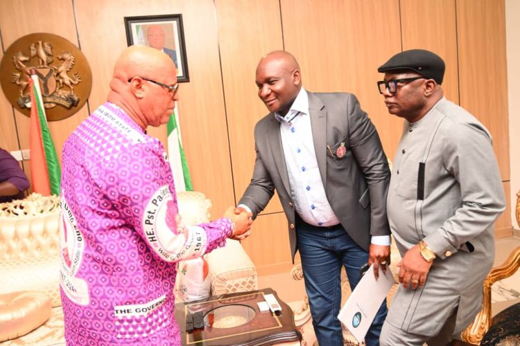 The Governor of Akwa Ibom State, Pastor Umo Eno (left) welcoming the NDDC Managing Director, Dr Samuel Ogbuku, (middle) and the NDDC Executive Director, Projects, Sir Victor Antai (right), during a condolence visit at his home town in Ikot Ekpene Udo, Nsit Ubium Local Government Area of Akwa Ibom State.